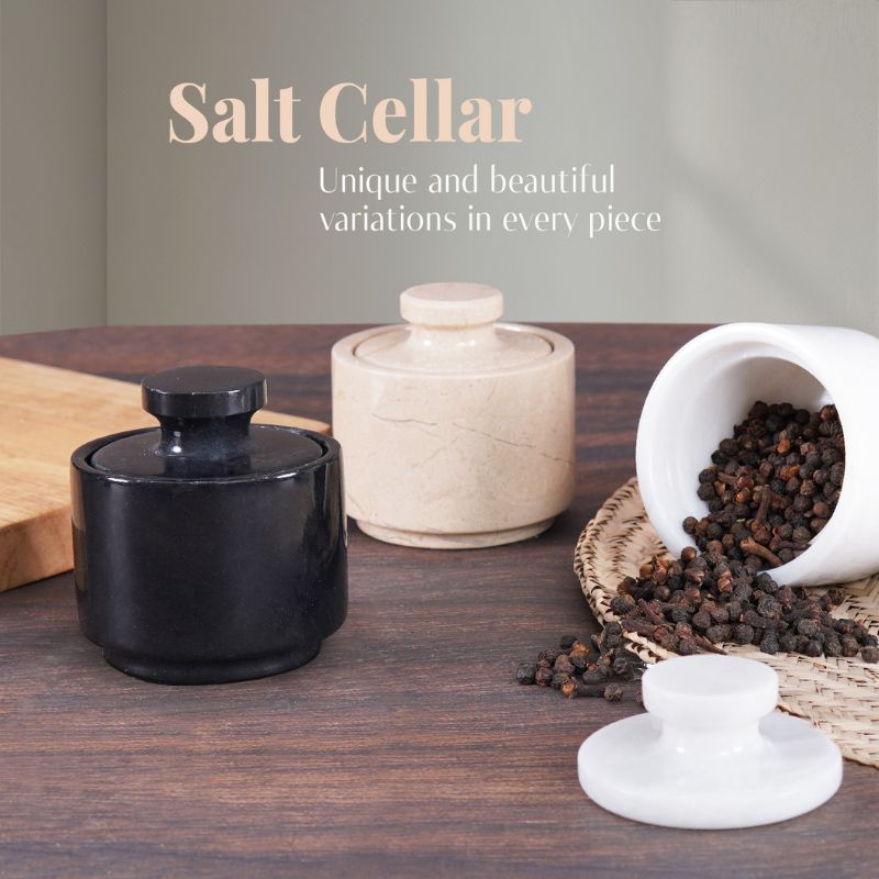 Black marble salt cellar displayed alongside marinara and white marble versions