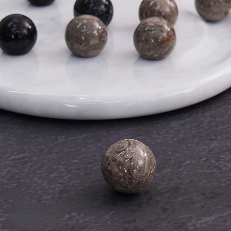 Close-up of oceanic marble ball from Tic Tac Toe game set