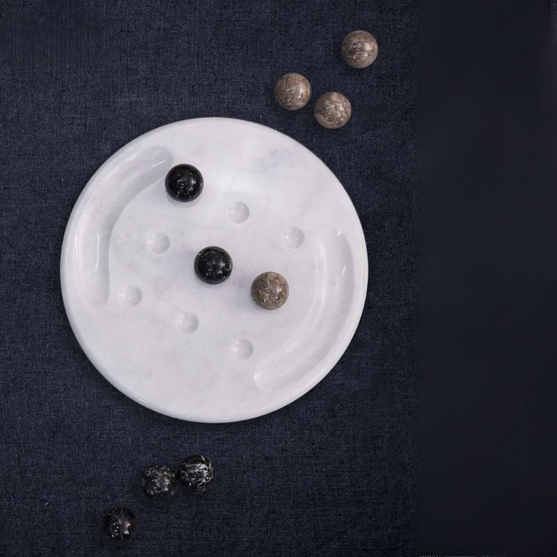 Oceanic and black marble Tic Tac Toe game set on dark fabric