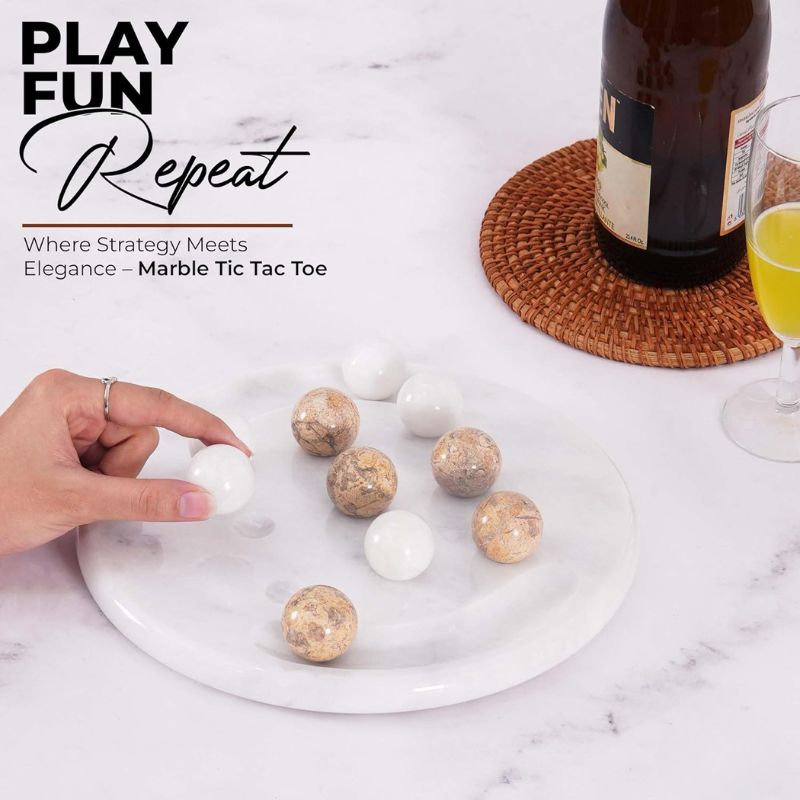 Playing coral and white marble Tic Tac Toe game set with drinks