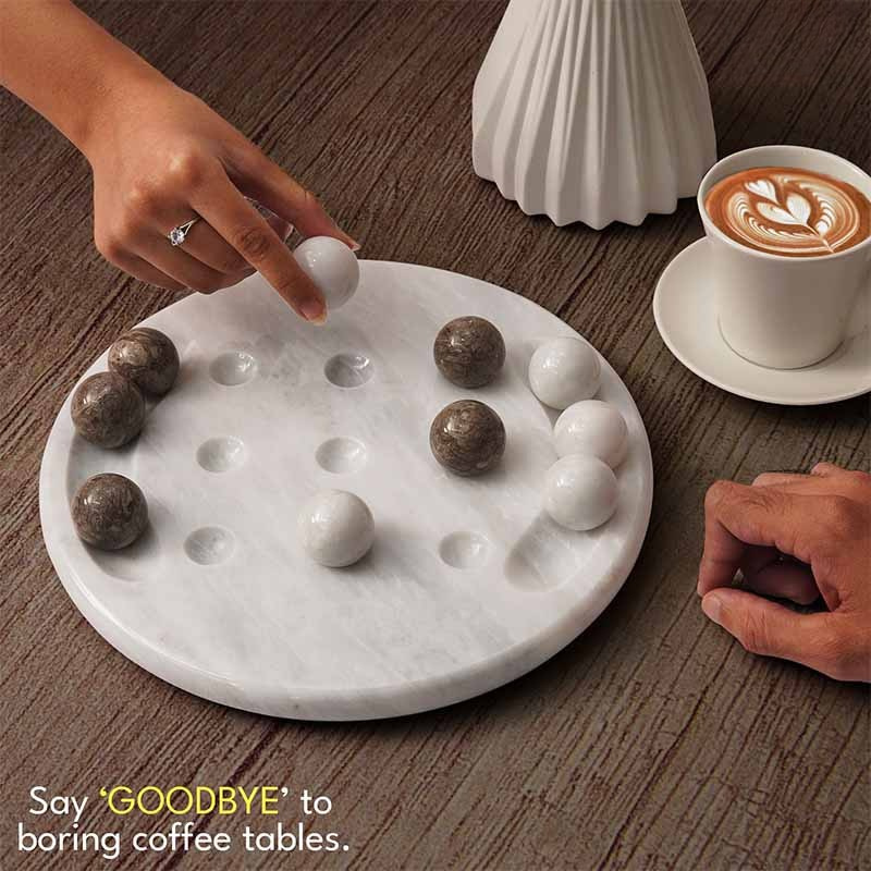 Couple enjoying marble Tic Tac Toe game over coffee—perfect for casual table play and modern decor.